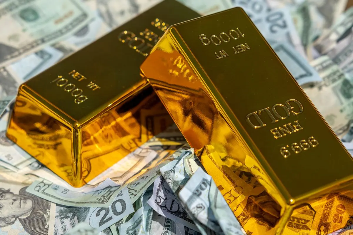 Barras de ouro em frente a prédios